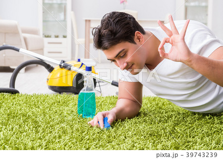 Young husband man cleaning floor at home Young husband man cleaning floor at home 39743239