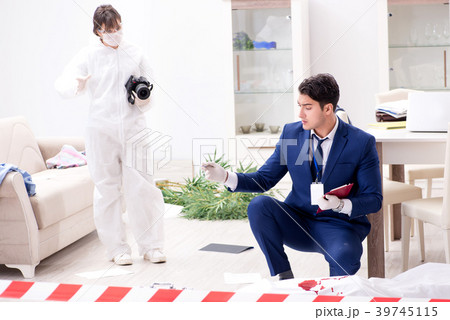 Forensics investigator at the scene of office 39745115