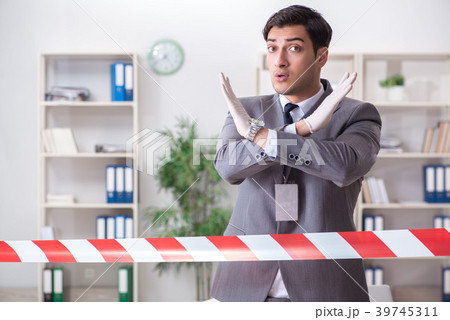 Forensics investigator at the scene of office 39745311