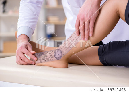 Doctor checking patients joint flexibility Doctor checking patients joint flexibility 39745868