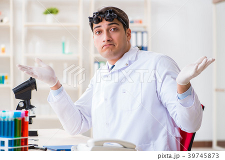 Young chemical scientist working in lab 39745873