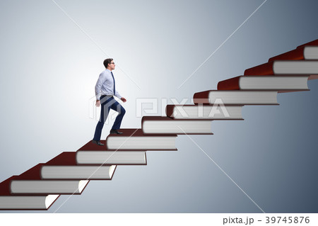 Businessman student climbing the ladder of 39745876