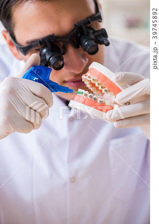 Young dentist working in the dentistry hospital Young dentist working in the dentistry hospital 39745892