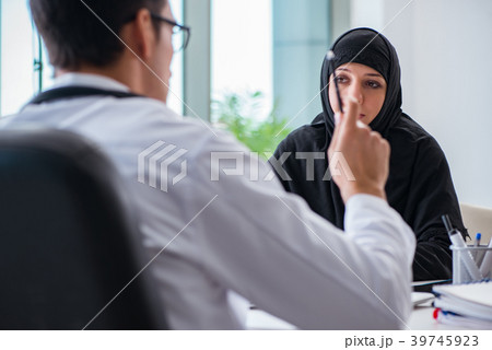 Muslim woman visiting doctor for regular check-up 39745923
