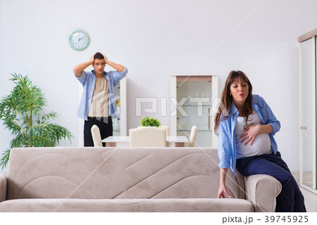 Pregnant woman with husband at home 39745925