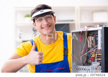 Computer repair technician repairing hardware 39746028