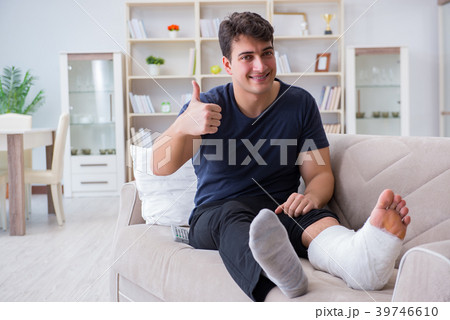 Man with broken leg recovering at home Man with broken leg recovering at home 39746610
