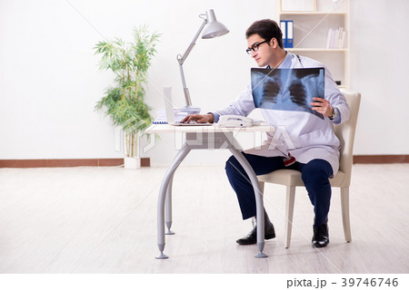 Young handsome doctor working in hospital room Young handsome doctor working in hospital room 39746746