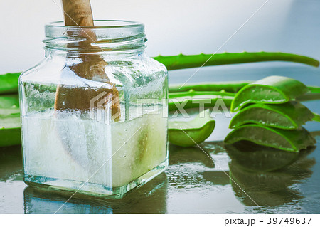 Fresh aloe vera and jelly in glass bottle 39749637