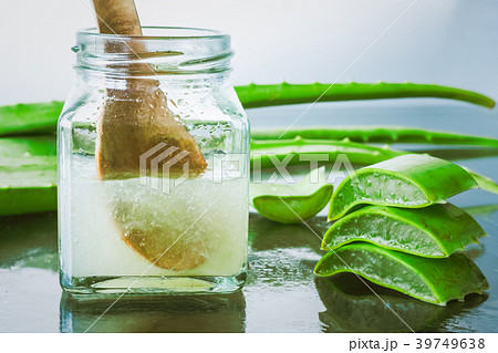 Fresh aloe vera and jelly in glass bottle Fresh aloe vera and jelly in glass bottle 39749638