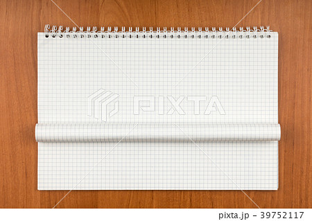 Notepad on a spiral with a curled sheet table. Notepad on a spiral with a curled sheet table. 39752117