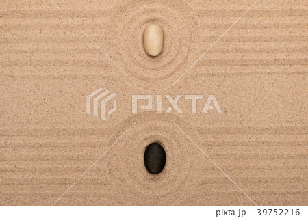 Two stone lies in the center of a circle of sand Two stone lies in the center of a circle of sand 39752216