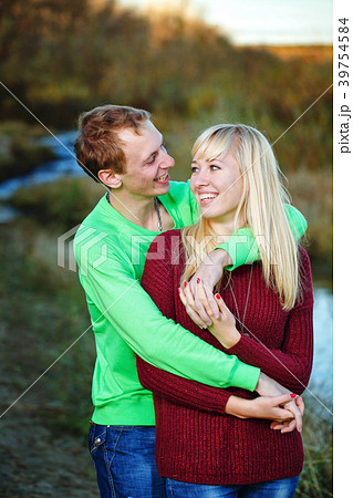 Young couple on banks of river 39754584