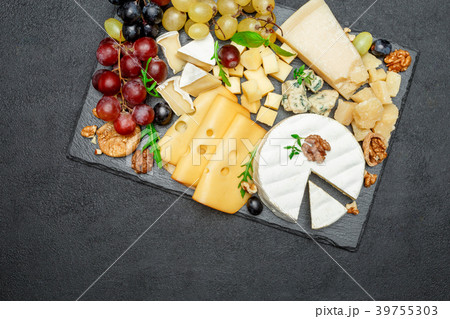 various types of cheese on stone serving board 39755303