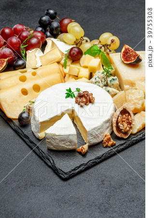 various types of cheese on stone serving board 39755308