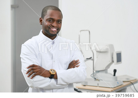Frontview of smiling man standing near medical Frontview of smiling man standing near medical 39759685