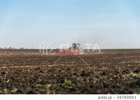 Tractor plowing fields. Tractor plowing fields. 39760001