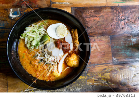 Serving of Nyonya Laksa, popular spicy noodle Serving of Nyonya Laksa, popular spicy noodle 39763313