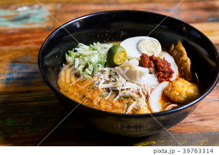 Serving of Nyonya Laksa, popular spicy noodle 39763314