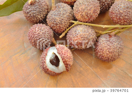 lychee tropical fruit peel out on wooden board 39764701