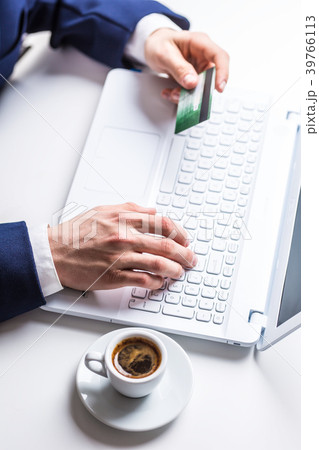 Man hands typing on the keyboard of laptop. Man hands typing on the keyboard of laptop. 39766113