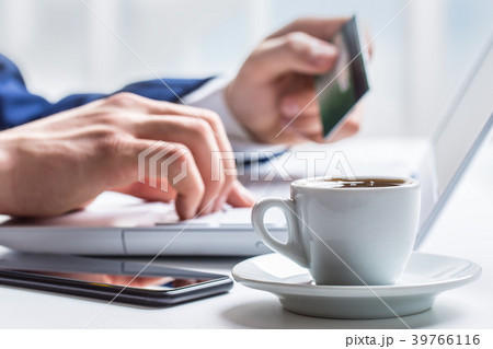 Man hands typing on the keyboard of laptop. Man hands typing on the keyboard of laptop. 39766116