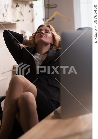 Young beautiful businesswoman is relaxing at Young beautiful businesswoman is relaxing at 39766460