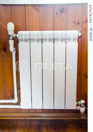 Hand regulates temperature in radiator 39767425