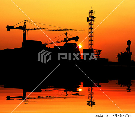 Silhouette crane construction building at sunset 39767756