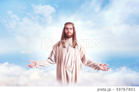 Jesus Christ with open arms against cloudy sky 39767801
