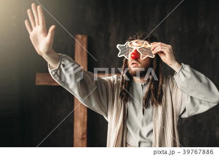 Jesus Christ in party glasses reaching out hand Jesus Christ in party glasses reaching out hand 39767886