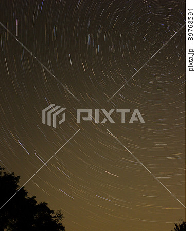Night sky with spiral star trails around Pole star 39768594