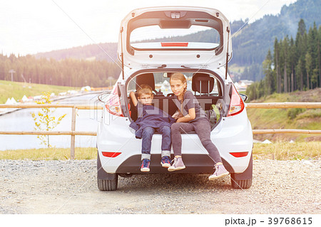 Family travelling by car and using map to navigate Family travelling by car and using map to navigate 39768615