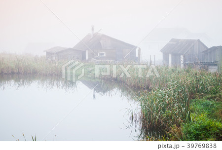 Foggy morning on a lake coast, Russia Foggy morning on a lake coast, Russia 39769838