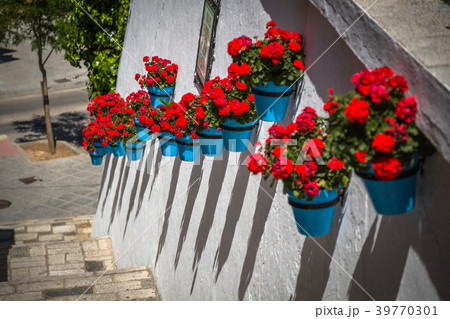 Street with flowers in the Mijas town, Spain 39770301