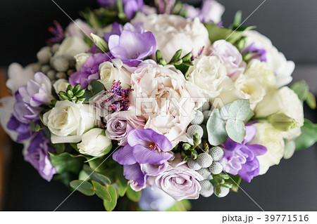 Brides wedding bouquet with peonies, freesia and Brides wedding bouquet with peonies, freesia and 39771516