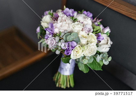 Brides wedding bouquet with peonies, freesia and 39771517