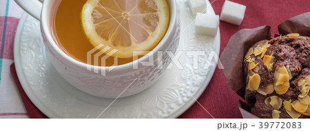 Tea with lemon and chocolate muffin Tea with lemon and chocolate muffin 39772083