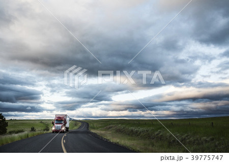 truck on a highway through the grasslands area of eastern Washington, USA. 39775747