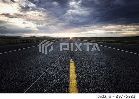 View down the centre line of a state highway at sunset in eastern Washington, USA. 39775832