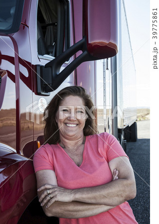 Portrait of a Caucasian woman driver and her commercial truck. 39775861