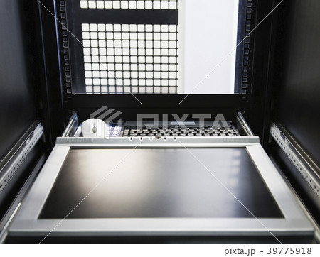 Monitor in the interior of a rack in a computer server farm. 39775918
