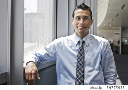 Caucasian businessman in lobby of a large office building. 39775953