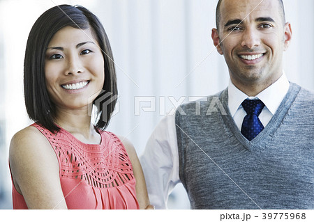 Portrait of an Asian businesswoman and Hispanic businessman. Portrait of an Asian businesswoman and Hispanic businessman. 39775968