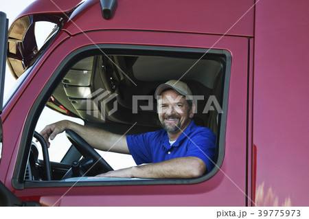 Portrait of a Caucasian man driver and his  commercial truck. 39775973