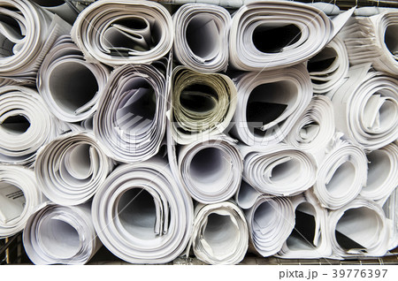 Close-up of blueprints on a desk top in a creative office. 39776397