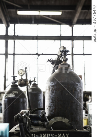 Closeup of oxyacetylene gas welding tanks in a sheet metal factory. 39776447