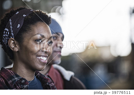 Black man and woman team of factory workers in a sheet metal factory 39776511