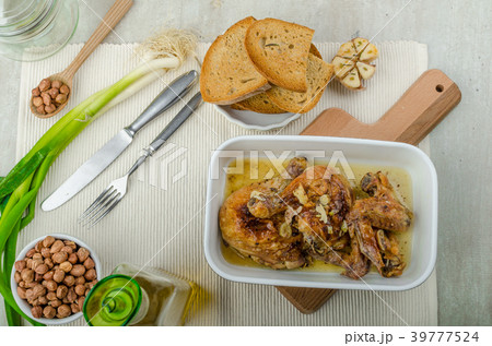 Roasted chicken parts with bio garlic, herb-garlic toast Roasted chicken parts with bio garlic, herb-garlic toast 39777524