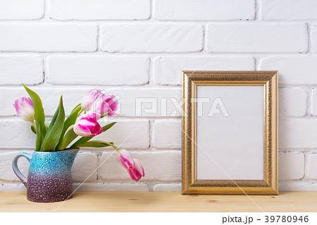 Gold decorate frame mockup with magenta pink tulip Gold decorate frame mockup with magenta pink tulip 39780946